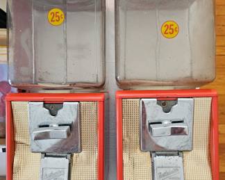 Pair of vintage glass Northwestern gumball candy vending machines.