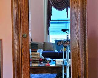 Antique Carved Tiger Oak Armoire Wardrobe Cabinet with Large Mirrored Door.