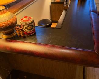 Vintage bar with brass rails, storage and sink