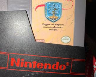 Vintage Nintendo games and two consoles