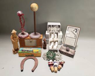 Lot # : 344 - Box of vintage napkin rings, desk clock, bottle stoppers, wood figurine, etc