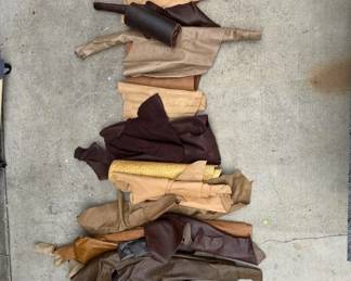 Lot # : 325h - Large group of leather hides in duffel bag