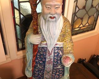 1 of a pair of large Chinese porcelain Imortal figures