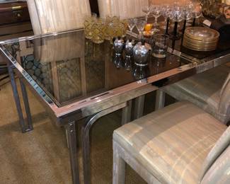 Cool chrome smaller dining table with black glass top