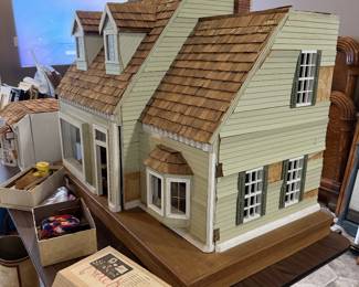 1960 doll house. Needs work, but has tons of miniatures. At one time all the lights lit up.