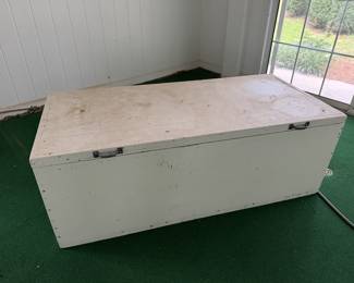 Large wood box that has been stored in pool area