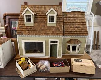 1960 doll house. Needs work, but has tons of miniatures. At one time all the lights lit up.