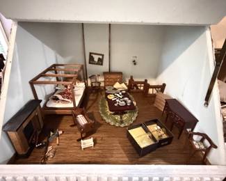 1960 doll house. Needs work, but has tons of miniatures. At one time all the lights worked.