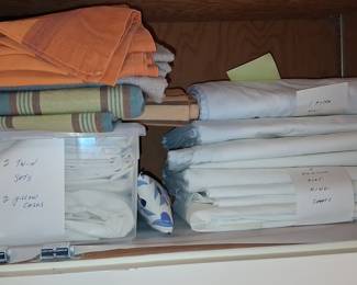 Assorted Linens: Twin Sheet Sets, King Flat Sheets, and Pillow Cases
