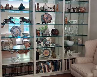 Glass Display Cabinet with Assorted Decorative Objects and Books