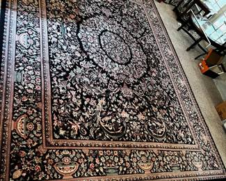 #5	Machine made rug. 129x98" Black w red and green pattern	 $120.00 