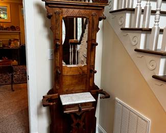 #11	Wood hall tree with carved floral design and marble top 31x10x84	 $275.00 
