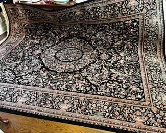 #5	Machine made rug. 129x98" Black w red and green pattern	 $120.00 