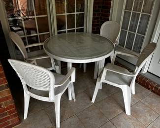 #85	Glass top white plastic table 39x29" w 4 chairs	 $75.00 