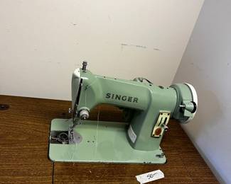 #100	Singer sewing machine Vintage model 185k in cabinet	 $50.00 