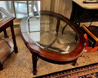 #15	Oval beveled glass top coffee table 42x28x16" 	 $50.00 
