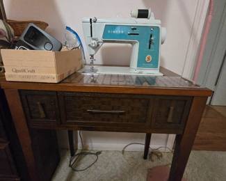 Singer sewing maching with cabinet
