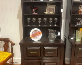 Four drawer, dark wood media console cabinet