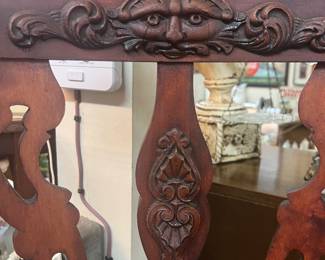 Carved face in parlor chair