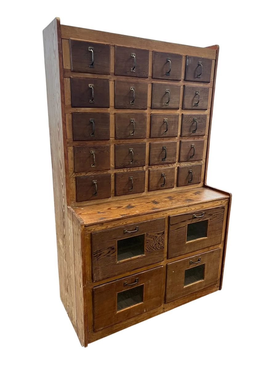 Pine apothecary cabinet w/seed bin drawers.