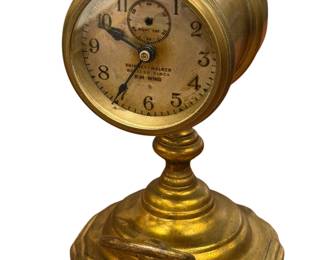 Early brass clock w/face winding dial ring