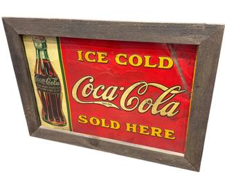 1920s metal Coke sign in frame.