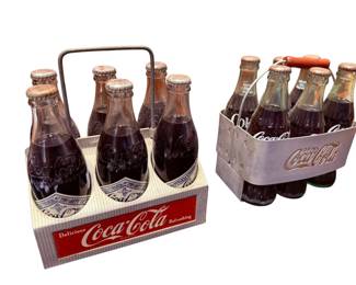 2 aluminum 6 pack coke carriers. w/bottles. 