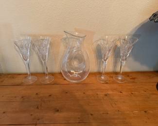 Two sets of Waterford flutes/glasses, glass water pitcher