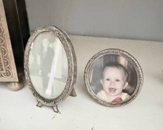 Antique ornate silver oval picture frames, pair