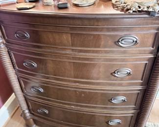 Antique mahogany bowfront chest with porcelain figurines