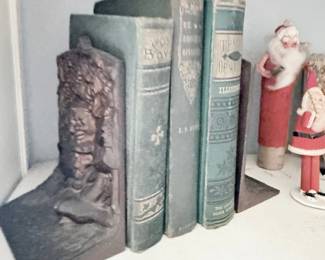 Antique books with figural bookend and Santa figure