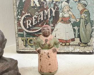 Riley's Creamy Toffee advertising tin with cast iron figure