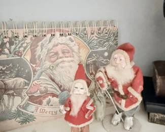 Vintage Santa Claus figures with antique Christmas postcard