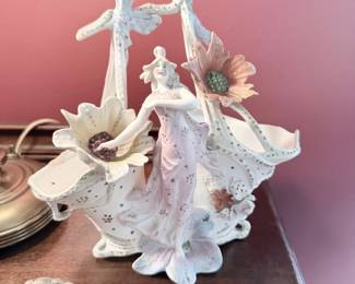 Antique porcelain lace figurine with applied flowers