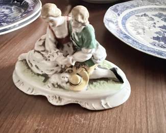 Antique porcelain figural group, children at play