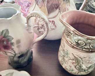 Antique porcelain pitchers and creamers, floral and embossed