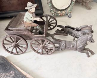 Antique cast iron horse-drawn wagon toy with driver