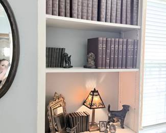 Antique leather-bound book sets with stained glass lamp