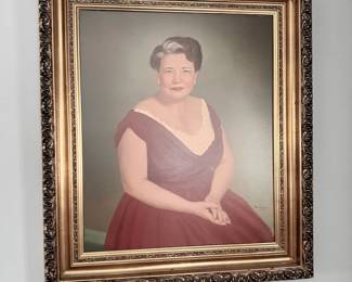 Framed portrait painting of woman in ornate gilt frame