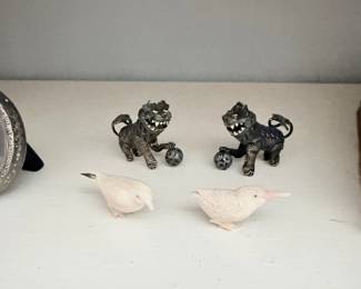 Antique cast iron foo dog bookends and carved bird figures