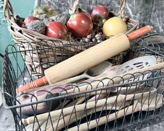 Vintage wood rolling pins and kitchen utensils in wire basket
