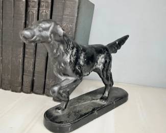 Antique cast iron setter dog doorstop with antique books