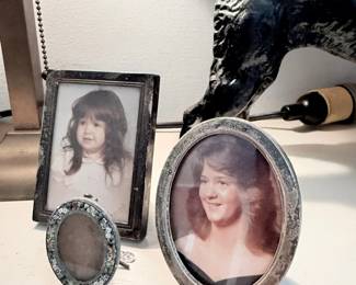 Antique silver picture frames and cast iron cat figure