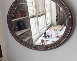Antique round wood-framed convex wall mirror