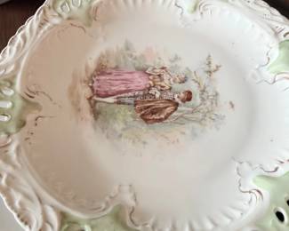 Antique transfer-decorated porcelain plate with embossed rim