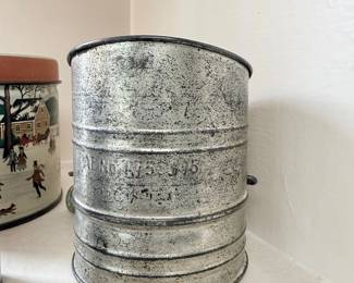 Vintage metal hand-crank flour sifter