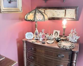 Antique mahogany bowfront dresser with slag glass lamp