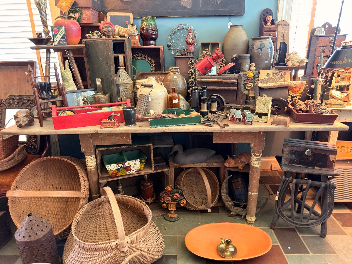 Antique stoneware crocks, splint baskets, primitive farm table