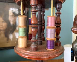 Antique wood spool caddy with thread