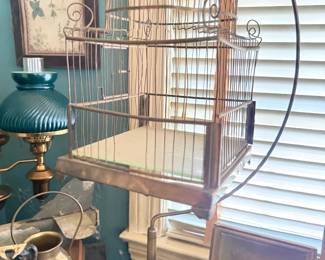 Antique wire bird cage and green shade student lamp